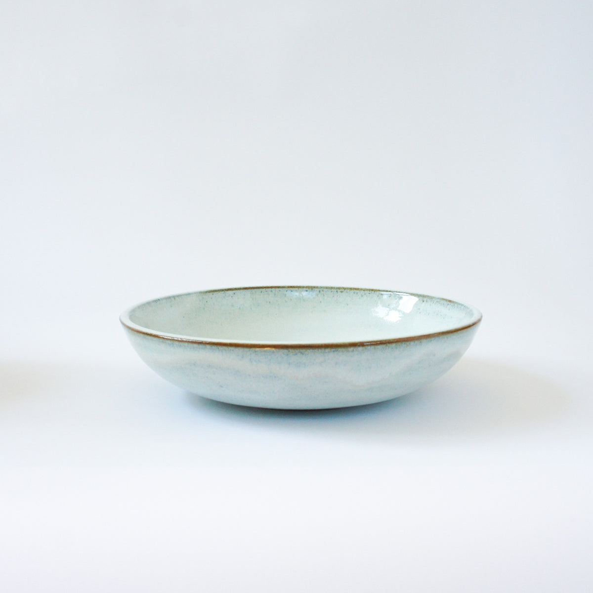 Deep plate with ice blue glaze