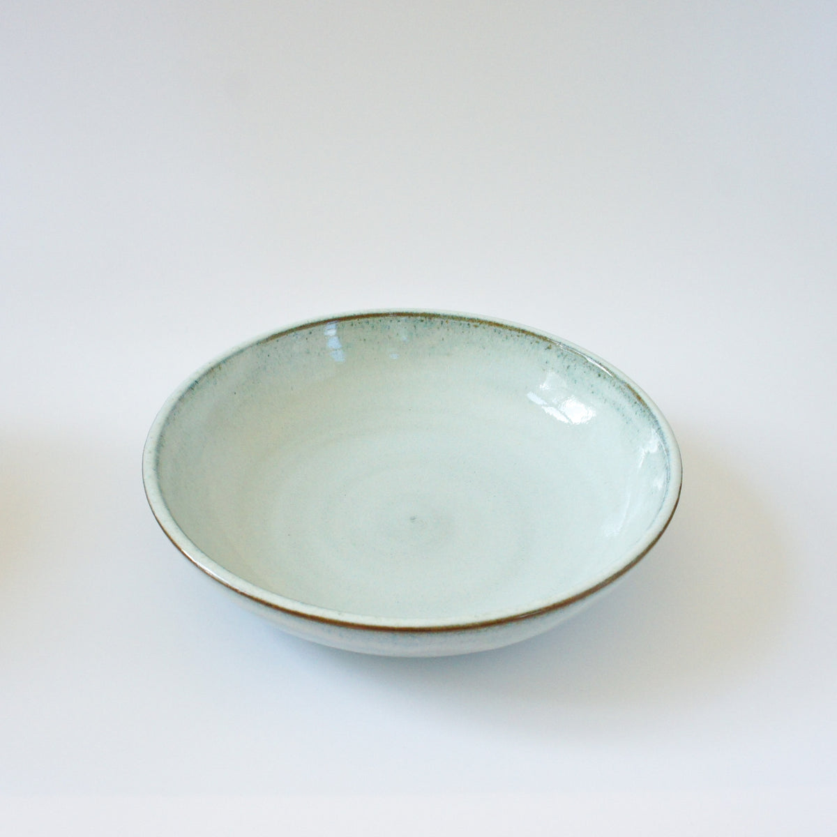 Deep plate with ice blue glaze